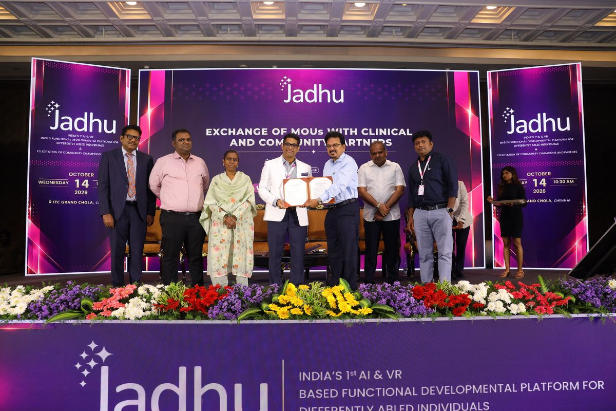 Signed Memorandum of Understanding between Jadhu and Chellamuthu Trust and Research Foundation, Madurai, exchanged on stage in front of the Exchange of MOUs backdrop